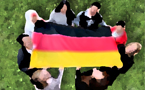 A group of students around the German Flag